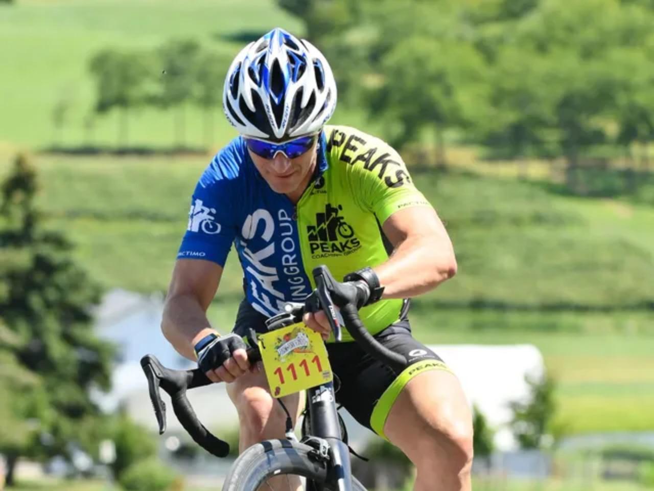 Hunter Allen racing a road bike in a Peaks Coaching Group kit.